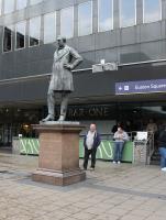 Bronze statue of Robert Stephenson, on the forecourt of Euston Station. The building of the London and Birmingham Railway was only one of many achievements in his comparatively short life. The Grade II listed statue was erected in 1871, Stephenson having died in 1859 just before his 56th birthday. <br><br>[Mark Bartlett 26/02/2017]