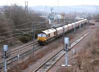 View south at Millerhill on 2 December 2003 as EWS 66246 runs through with coal empties off the ECML heading for Hunterston via the sub.<br><br>[John Furnevel 02/12/2003]