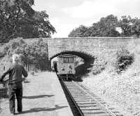 Station master Scott watches the last freight leaving Gordon station, Berwickshire, on 16 July 1965. The photograph may be familiar - it is the front cover photograph used for <a target=article href=https://www.railscot.co.uk/page/bordermemoriesbook>Memories of Lost Border Railways</a> by Bruce McCartney.<br><br>[Bruce McCartney 16/07/1965]