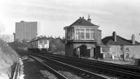 The signal box at Busby Junction is approached by a Barrhead bound DMU.<br><br>[Ian Millar 29/01/1974]