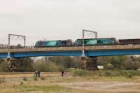 88002 <I>Prometheus</I> and 68025 <I>Superb</I> turn a few heads as they cross the River Lune on Carlisle Bridge with the northbound test train on 6th April 2017. The similarities between the two locos is very noticeable in this side view.  <br><br>[Mark Bartlett 06/04/2017]