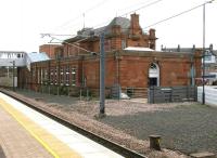 The classic lines of the main station building at Berwick, as rebuilt by the LNER in 1927, seen here in July 2005 from the island platform looking east over the site of the old south bay. Beyond the building is the main car park and station approach road, with the Castle Hotel just visible on Railway Street in the right background. For the front view [see image 4754].<br><br>[John Furnevel 05/07/2005]
