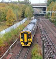 Autumn colours abound at Newcraighall North Junction on 16 October 2016 as ScotRail 158734 turns south west towards Shawfair with a morning Borders Railway service to Tweedbank shortly after leaving Newcraighall station. <br><br>[John Furnevel 16/10/2016]