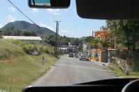 A former level crossing in Sandy Point Town, St Kitts, immediately to the south of the La Vallee limit of rail operations. This view was taken from a bus returning rail passengers to Basseterre to complete the circular trip. The twelve mile disused section of line can be seen at various points from this road along the west coast.
