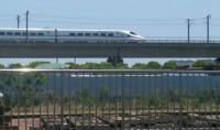 Grab shot of a 16 car CRH2 train speeding south on the Shanghai-Hangzhou High Speed railway in the direction of Hangzhou in Zhejiang Province.  Taken from train C3659 at Xinqiao Station heading from Shanghai South to Jinshanwei.<br><br>[Mark Poustie 29/05/2017]