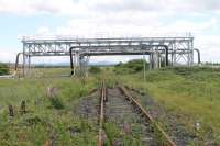 The view looking south along the mothballed Seal Sands branch in June 2017, taken from the level crossing near the actual junction where trains reversed. [See image 59796] for the (broadly similar!) view of the railway in this industrial landscape in the opposite direction. <br><br>[Mark Bartlett 24/06/2017]