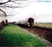 A speeding along passenger train passes Watten on the way to Georgemas from Wick.<br><br>[Ewan Crawford //]