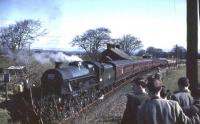 Jubilee 45588 <I>Kashmir</I> makes a photostop at Shieldhill, midway between Lockerbie and Dumfries, on 15 April 1963 with <I>Scottish Rambler No 2</I>. Passenger services had been withdrawn from the branch in 1952 and the line closed completely in 1966.<br><br>[John Robin 15/04/1963]
