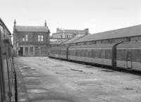 Ardrossan Town with a class 107 in the bay platform. This photograph was taken in 1985, the station had closed in 1965 and would re-open in 1987. Two sidings, one alongside the platform, remained in the bay for stabling in 1985.<br><br>[Bill Roberton //1985]