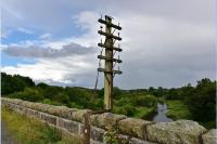The viaduct at Ellon over the River Ythan has a telegraph pole still in situ on the east parapet with a support forged from a rail.<br><br>[John Gray 23/08/2017]
