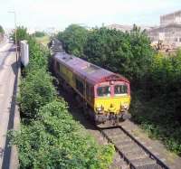 EWS 66205 moving away from Seafield level crossing on 7 June 2006 with a trainload of imported coal from Leith Docks. The contents are destined for Cockenzie power station. <br><br>[John Furnevel 07/06/2006]