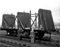 The caption on the reverse of this undated British Railways PR&PO photograph<br>
reads 'The new Timber-P wagon constructed at Barassie Workshops receive the<br>
finishing lick of paint from painters Willie Burgess and Willie Clearie.' The picture probably dates from 1966 when redundant Conflat P stock was rebuilt into the 22T Timber-P design for use on timber trains between Crianlarich Lower and the then new pulp and paper mill at Corpach.<br><br>[PR&PO British Railways (Douglas Blades Collection) //1966]