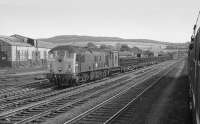 24009 with a train of bullhead track panels in the loops to the south of Perth.  Seen from the 'Strathmore Express', returning from Forfar on 25 May 1974. Former railway works are seen in the background.<br><br>[Bill Roberton 25/05/1974]