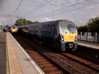Milngavie (right) and Edinburgh services pass at Uphall on 25th September 2017. Unusually the Edinburgh train is only formed of three coaches so I've now got to leg it!<br>
<br><br>[David Panton 25/09/2017]