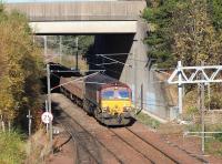 Ballast arriving at Millerhill on 5 November 2017 behind 66077 about to enter the yard past Newcraighall North Junction. The train is the 0820 Perth - Millerhill SS.<br><br>[John Furnevel 05/11/2017]