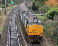 37402 slows as it drops down the bank towards Lancaster Castle station with 2C47, 1004hrs Preston to Barrow-in-Furness, on a gloomy 31st October 2017. <br><br>[Mark Bartlett 31/10/2017]