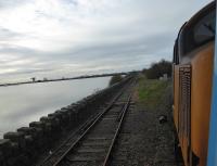 View of the Barrow Docks branch at Salthouse Junction from the 2C47 Preston to Barrow service on 13th November 2017. The line still sees traffic on an as required basis. This is primarily imported nuclear loads to be taken to Sellafield for reprocessing. <br><br>[Mark Bartlett 13/11/2017]