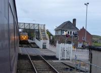 Class 37 hauled Cumbrian Coast services pass at St Bees on 13th November 2017. The substantial signal box controls the passing loop between the single line sections from Whitehaven and Sellafield, and the level crossing. <br><br>[Mark Bartlett 13/11/2017]