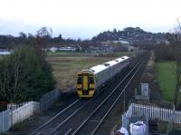 ScotRail 158782 passes Stirling's former St. Ninian's (Millhall Road) crossing which had, until relatively recently, the dubious honour of being regarded as Scotland’s highest risk pedestrian level crossing. View is north from the new footbridge completed during 2017.<br><br>[Colin McDonald 31/12/2017]