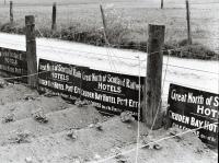 Multiple hotel signs for Cruden Bay Hotel seen at Inverurie in 1961. 'Great North of Scotland Railway - Hotels - Cruden Bay Hotel Port-Errol - Golf Course One of the Finest in Scotland'.<br><br>[David Murray-Smith /06/1961]