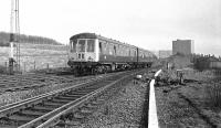 Carlisle bound Derby DMU passing Busby Junction in 1974. The unit is a Carlisle based set, with bars over the drop lights for working over the Cumbrian Coast line with its restricted clearances. The signal box at Busby Junction had been recently decommissioned. <br>
<br><br>[Ian Millar //1974]