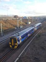 158713, on the 1422hrs Waverley to Tweedbank service, after passing Newcraighall on 15th January 2018. Beyond is the new EMU depot, complete with electric train.<br>
<br>
<br><br>[John Yellowlees 15/01/2018]