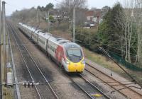 <I>Silver is so yesterday - unfortunately</I>. 390010 <I>Cumbrian Spirit</I>, one of a growing number of all white Pendolinos, runs south alongside the Oxheys Loop near Preston with a Glasgow to Euston service on 22nd January 2018. <br><br>[Mark Bartlett 22/01/2018]