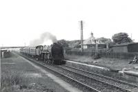 72009 <I>Clan Stewart</I> runs through the site of the original Troon station on 4 July 1959 with the 5.10pm Glasgow St Enoch - Stranraer train.<br><br>[G H Robin collection by courtesy of the Mitchell Library, Glasgow 04/07/1959]