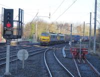 Freightliner 90041 & 90045 take the Up Fast line through Lancaster with a Coatbridge to Daventry intermodal service on the morning of 18th February 2018. The buffers on the right sit on the formation of the chord to Lancaster Green Ayre, closed in 1966. <br><br>[Mark Bartlett 20/02/2018]