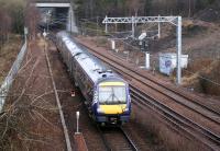 ScotRail 170450 is about to come off the Borders line at Newcraighall North Junction with the 0845 Tweedbank - Edinburgh Sunday service on 11 March 2018. The train is slowing for the stop at Newcraighall station just beyond the bridge.<br><br>[John Furnevel 11/03/2018]
