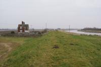 The remote station of Ferry on the M&GN railway between Wisbech and Sutton Bridge seen looking north on 22 February 2018. The photo is taken from the top of the embankment along the River Nene. The railway was to the left of the station building.<br><br>[John McIntyre 22/02/2018]