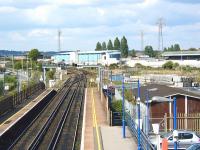 Looking north over Poole station during a quiet period on 31 May 2002. Poole stadium stands in the background.<br><br>[Ian Dinmore 03/05/2002]