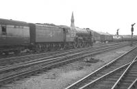 The combined coaches of the 2.30pm ex-Hull and the 2.52pm ex-Leeds Central are taken south from Doncaster bound for Kings Cross on Saturday 29 July 1961. Locomotive in charge is Doncaster based A1 Pacific 60128 Bongrace.    <br><br>[K A Gray //]