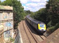 <h4><a href='/locations/B/Bath_Spa'>Bath Spa</a></h4><p><small><a href='/companies/G/Great_Western_Railway'>Great Western Railway</a></small></p><p>Graffiti is unusual in Bath, but the building on the left is uninhabited. In July 2018 it seemed to be under rather slow restoration. The Westbound HST may have a less promising future. 95/122</p><p>31/07/2018<br><small><a href='/contributors/Ken_Strachan'>Ken Strachan</a></small></p>