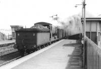 J37 0-6-0 64625 passing through Piershill Station with goods vans in 1963.<br><br>[John Robin 31/05/1963]