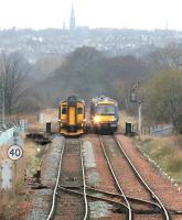 Looking west at the Edinburgh skyline as trains diverted over the sub meet on the bridge across Duddingston Park South road on Sunday 2 April 2006. Niddrie West Junction is in the foreground.<br><br>[John Furnevel 02/04/2006]