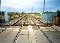 A short section of the West Coast Mainline belonged to the North British. Looking north from Heatherbell Level Crossing to Garnqueen South Junction.<br><br>[Ewan Crawford //1987]