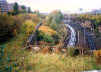 Overlooking Kinning Park Junction at Shields Road. The flyunder meets the Burma road. From left to right; Shields station (GSW, closed), Burma Road, Shields Road and Pollokshields extreme right. (Today the view is obscured by trees).<br><br>[Ewan Crawford //1987]