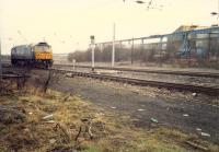 A 47 creeps up to the signal at the entry for Shieldmuir Yard which gave access to the Netherton Branch - a steelworks only in use for scrap provision for Ravenscraig by this date. This site is now Shieldmuir station and the yard is lifted.<br><br>[Ewan Crawford //1988]