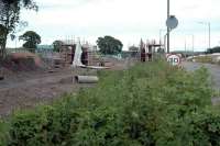 The replacement road overbridge for the Hilton Road level crossing takes shape just west of the former Kincardine Junction. View looks east.<br><br>[Ewan Crawford 24/06/2006]